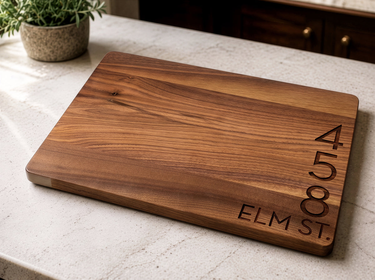 Walnut cutting board laser engraved with a street address, realtor closing gift