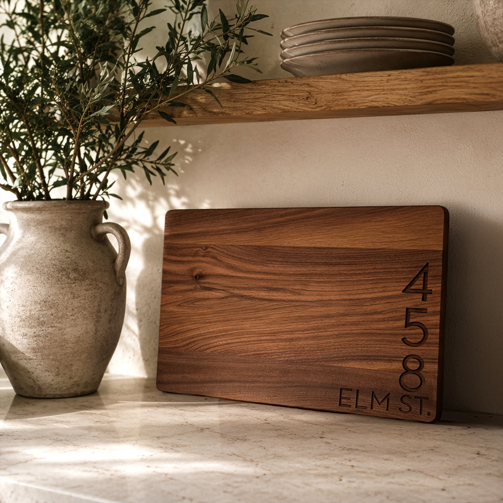 Walnut cutting board laser engraved with a street address, realtor closing gift